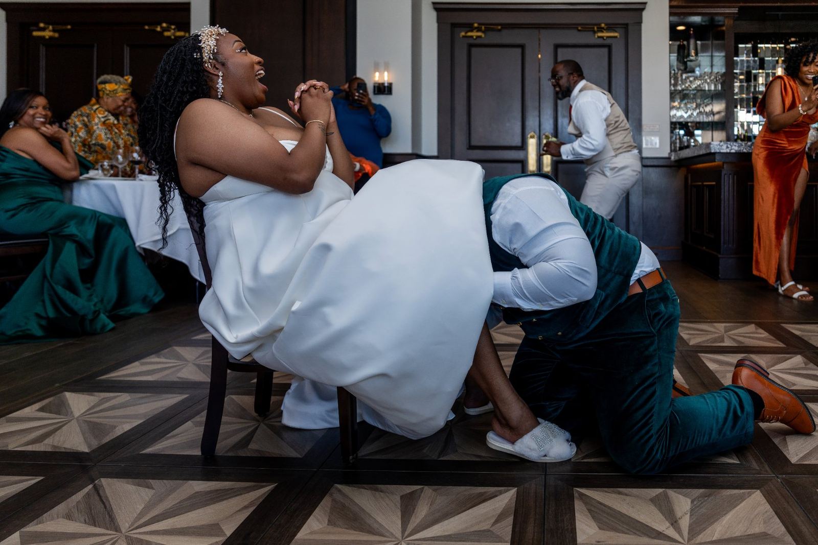Las Vegas wedding photography — bride seated with the groom kneeling beside her
