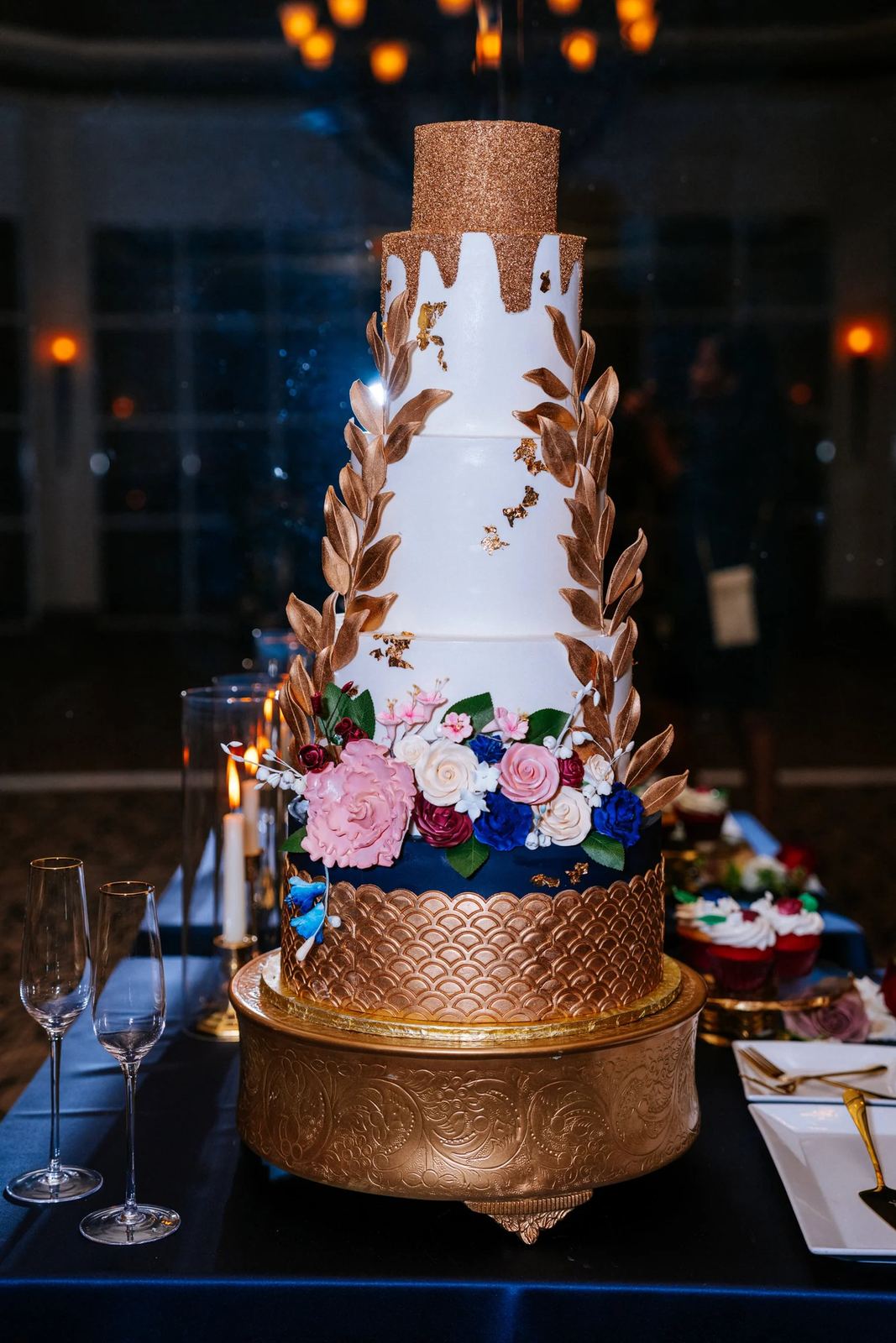Las Vegas wedding photography — tiered wedding cake with gold accents and florals