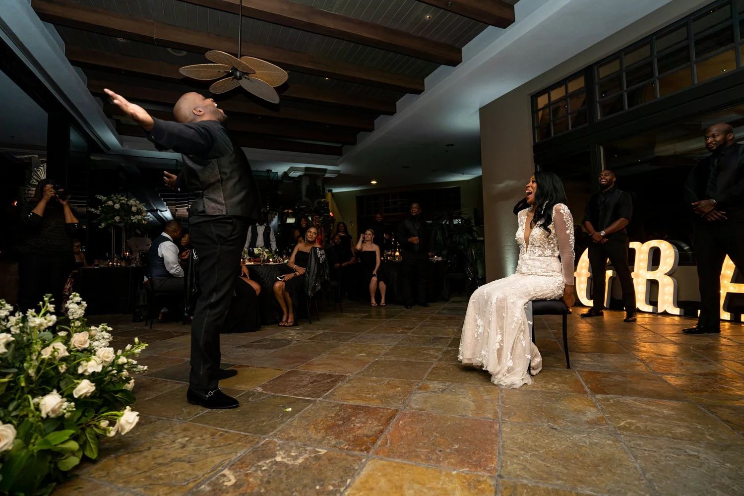 Las Vegas wedding photography — bride laughing during a toast at the reception