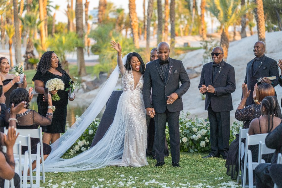 Las Vegas wedding photography — guests cheering as the couple walks the recessional