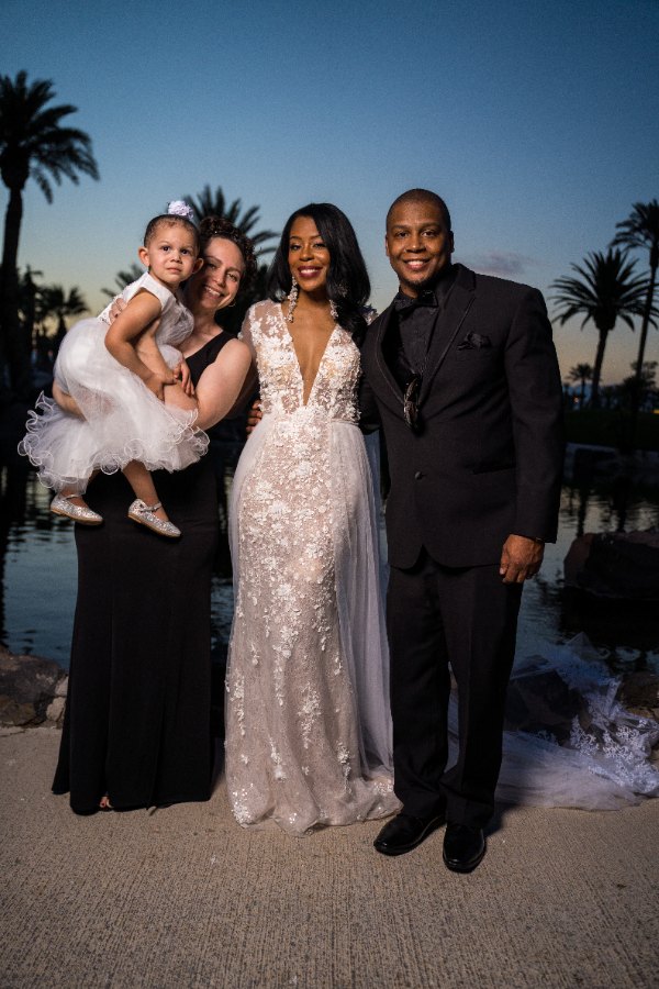 Las Vegas wedding photography — a family portrait by the water at dusk