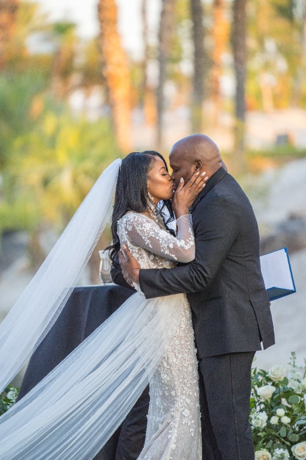 Las Vegas wedding photography — the first kiss with palm trees behind
