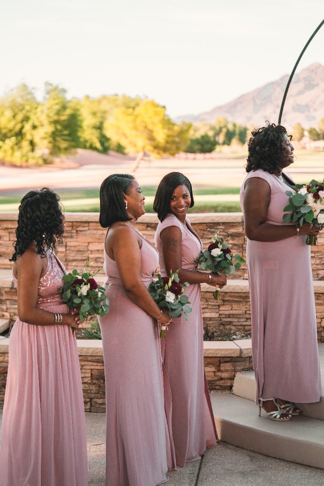 Las Vegas wedding photography — bridesmaids in blush gowns holding jewel-toned bouquets