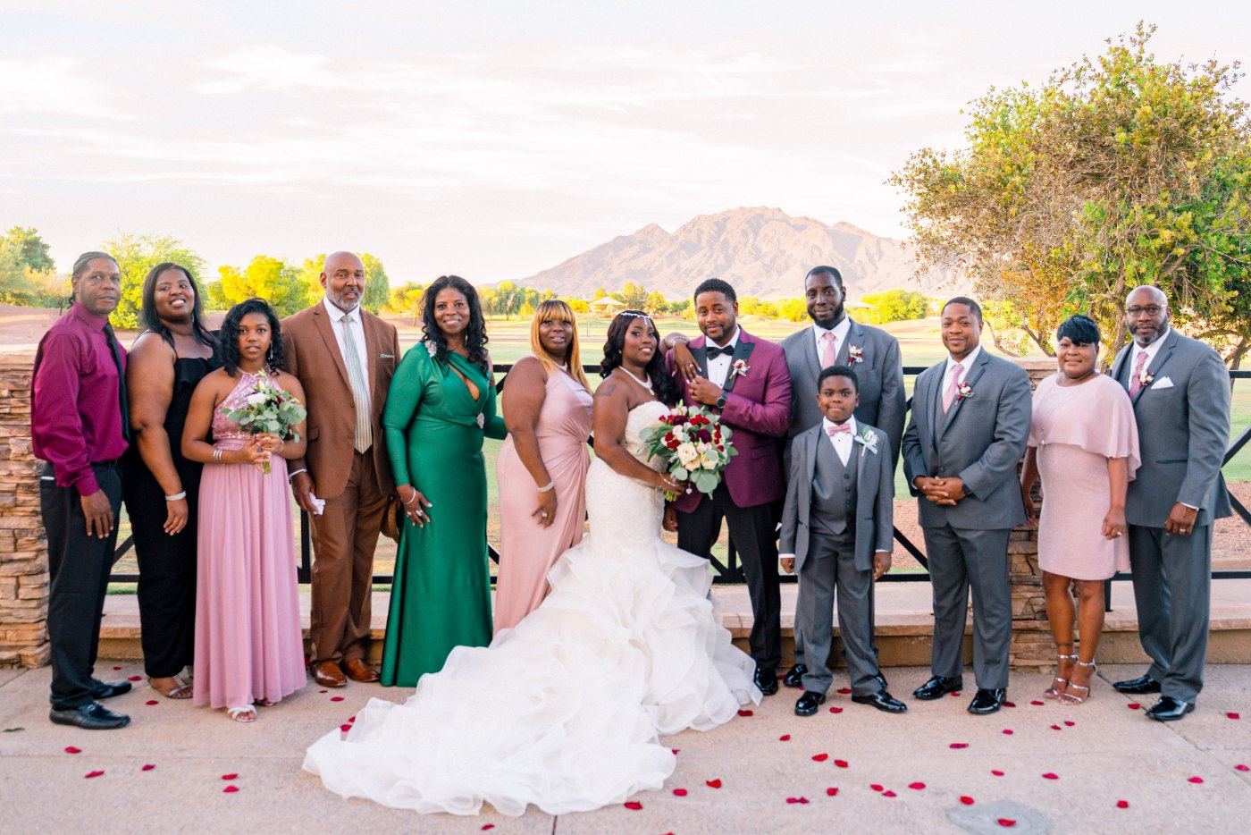 Las Vegas wedding photography — the full wedding party lined up on the petal-strewn path
