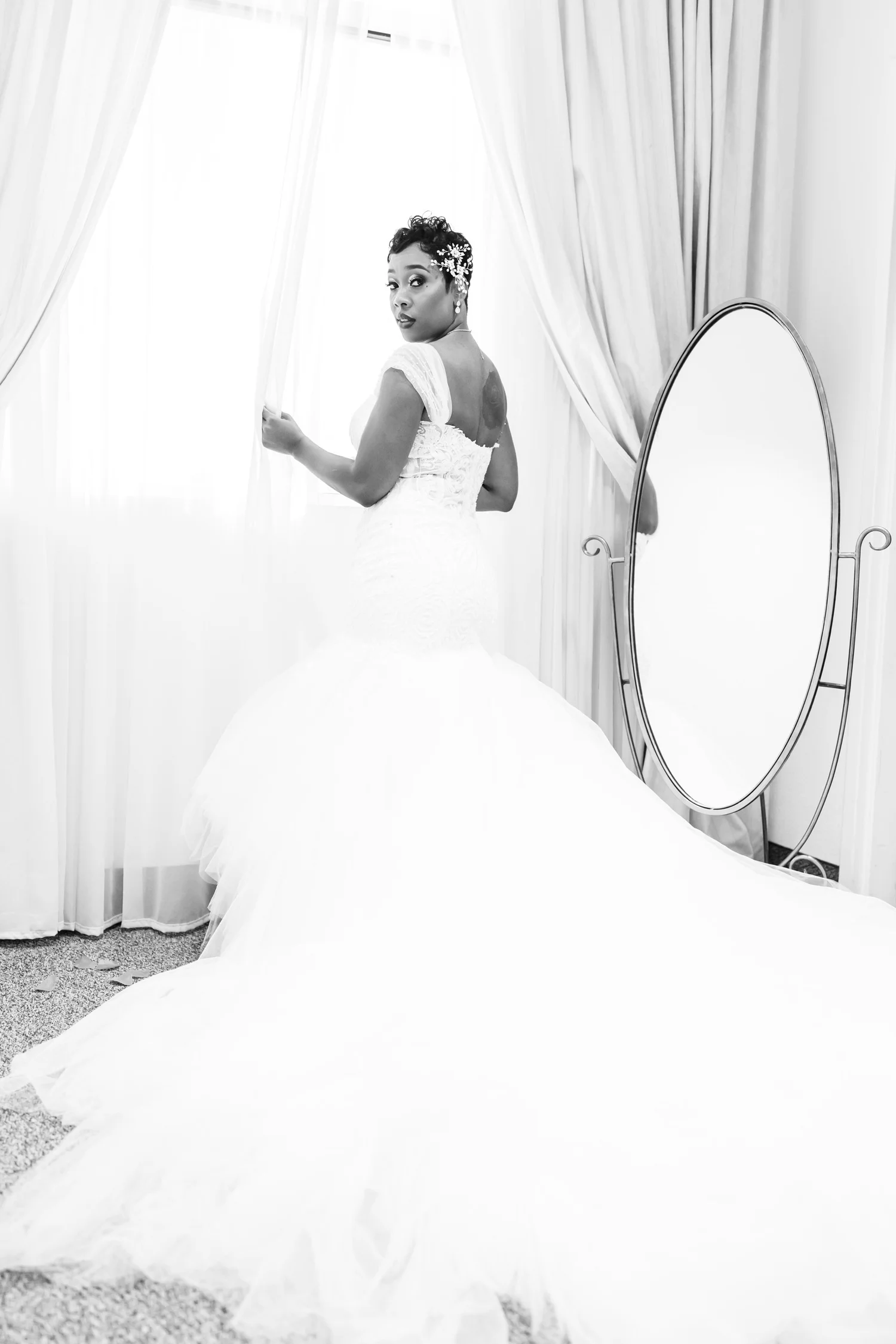 Las Vegas wedding photography — bride with hair jewelry by a window and mirror