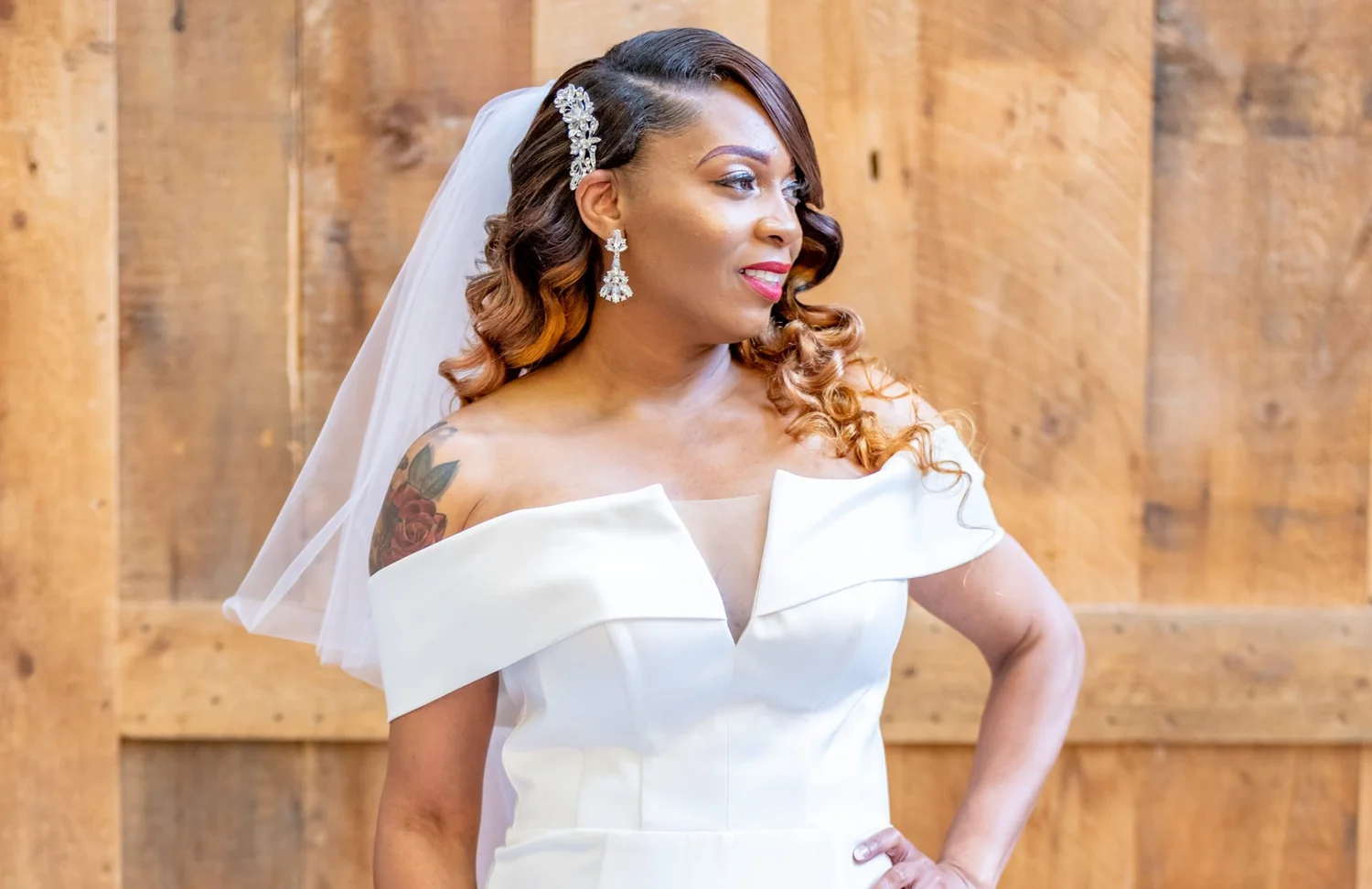 Las Vegas wedding photography — off-the-shoulder gown and veil against a wooden backdrop