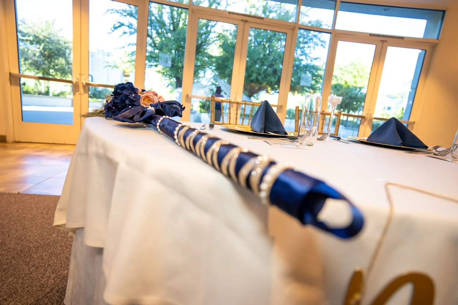 Las Vegas wedding photography — banquet table set with navy napkins and florals