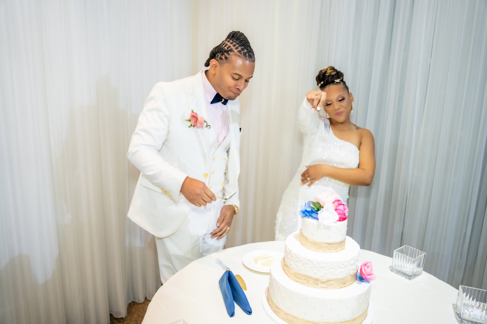 Las Vegas wedding photography — the couple cutting their wedding cake