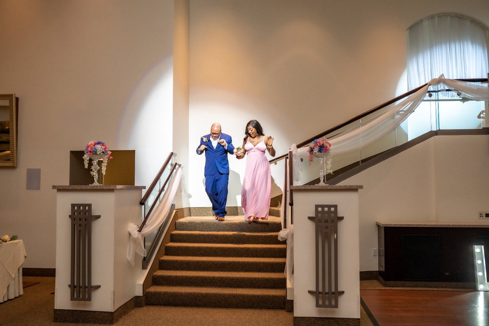 Las Vegas wedding photography — the wedding party descending a grand staircase