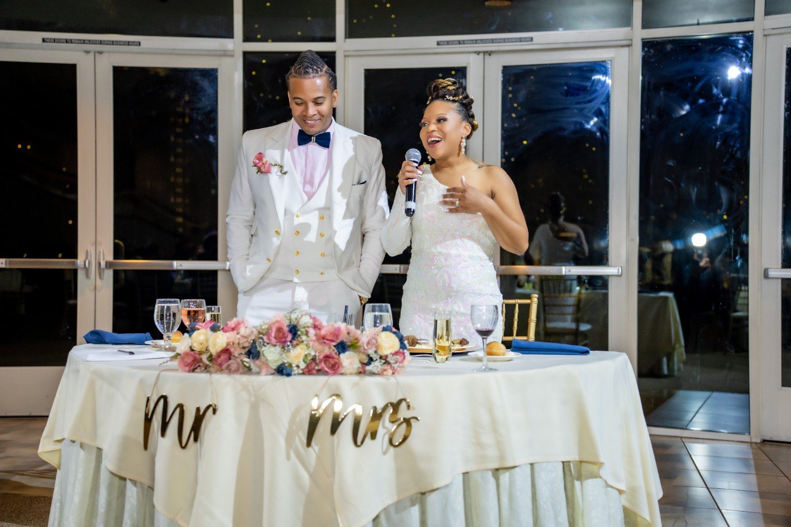 Las Vegas wedding photography — toasts being given at the Mr. & Mrs. table