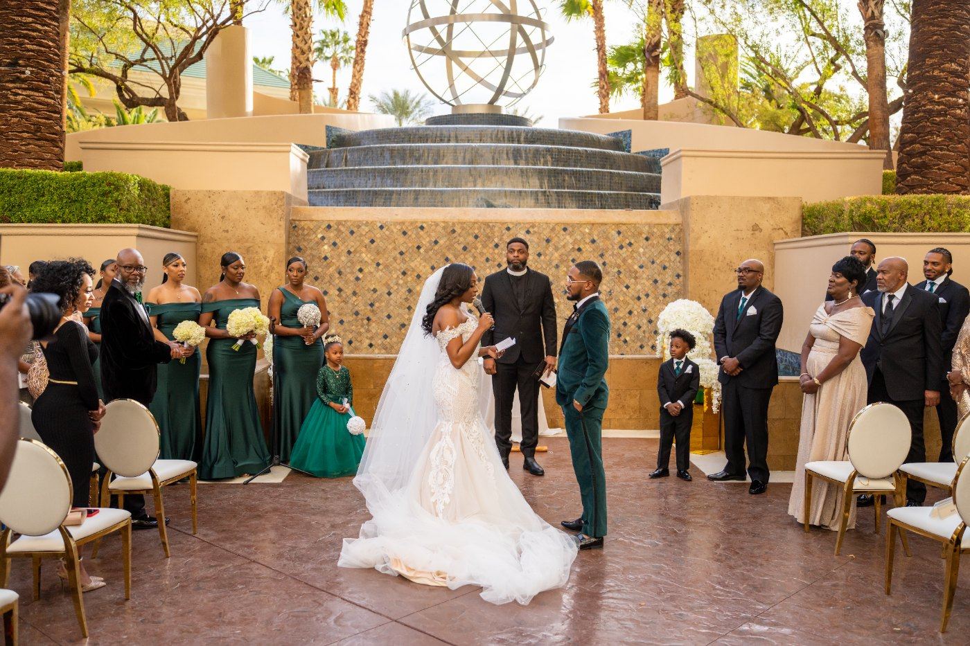 Las Vegas wedding photography — the bride reaching the altar as guests look on
