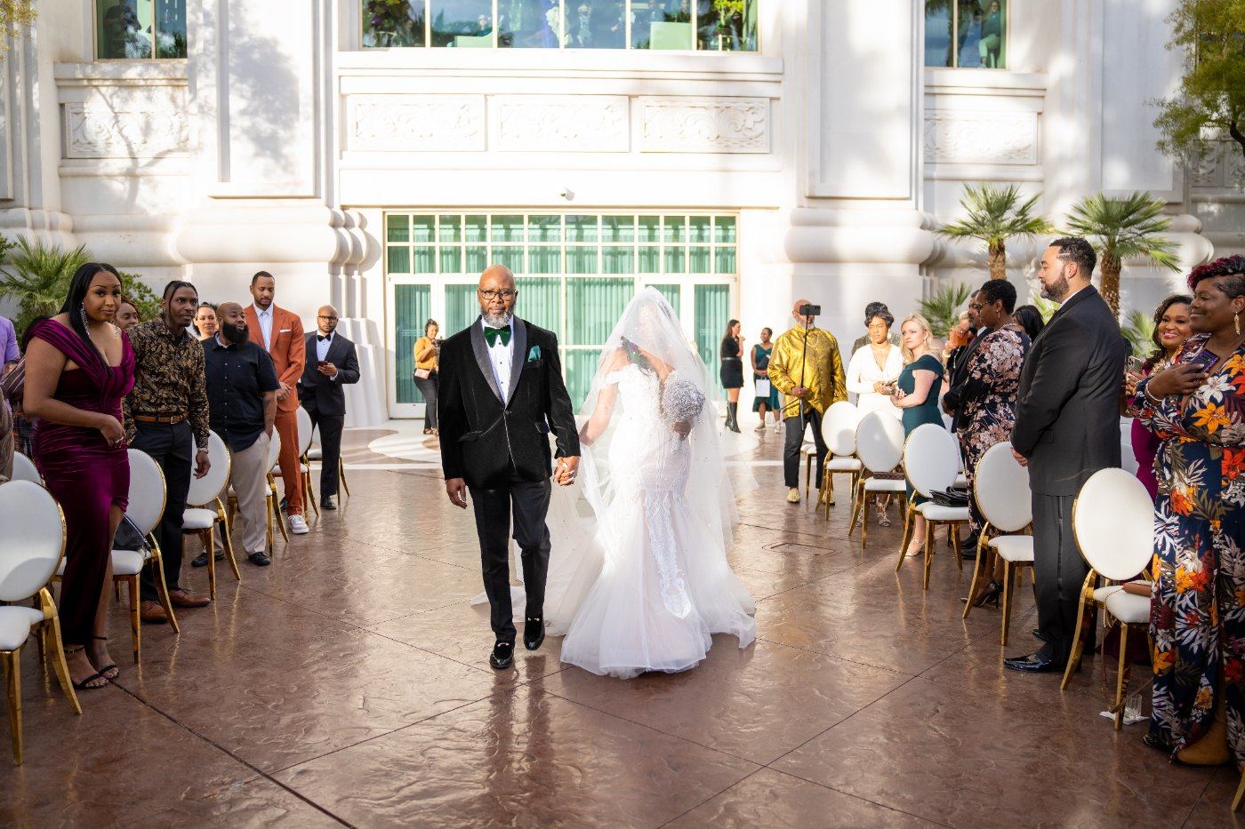 Las Vegas wedding photography — walking down the aisle past the seated guests