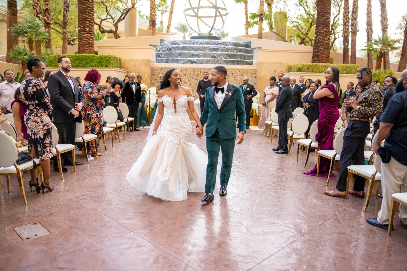 Las Vegas wedding photography — walking out past guests on their feet
