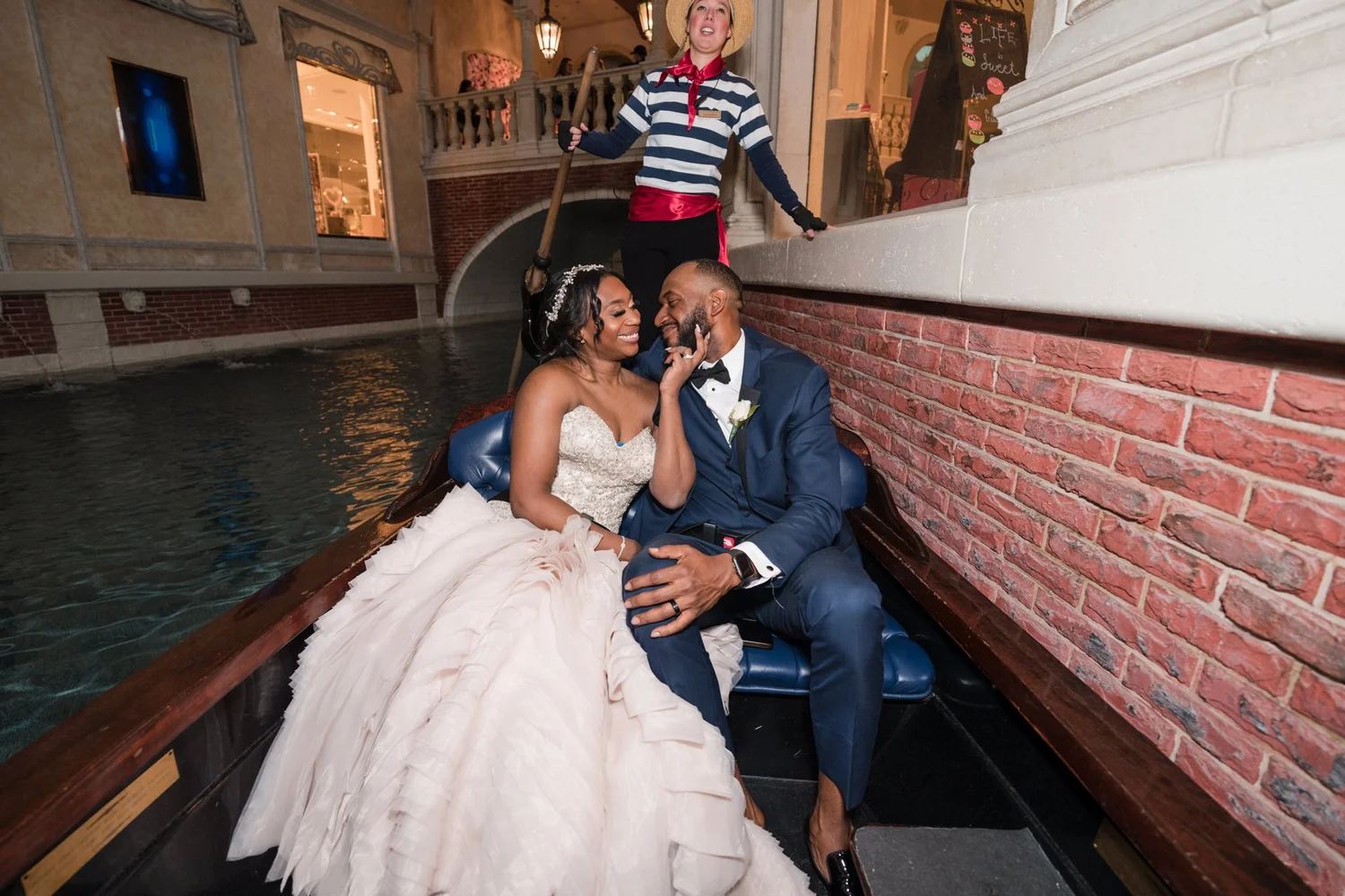 Las Vegas wedding photography — couple in a gondola on an indoor waterway