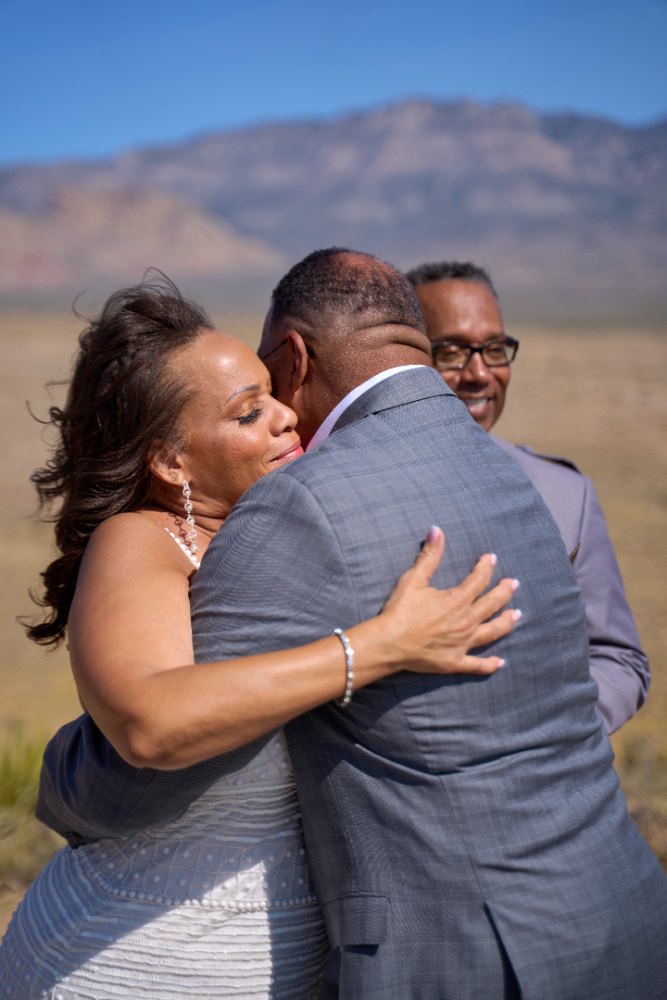 Las Vegas wedding photography — a family embrace out in the open desert