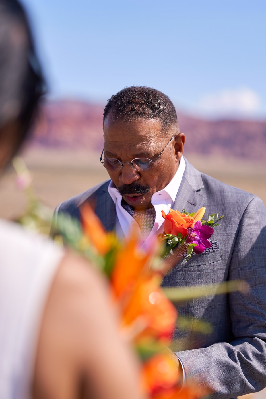 Las Vegas wedding photography — the officiant reading the vows in the sun