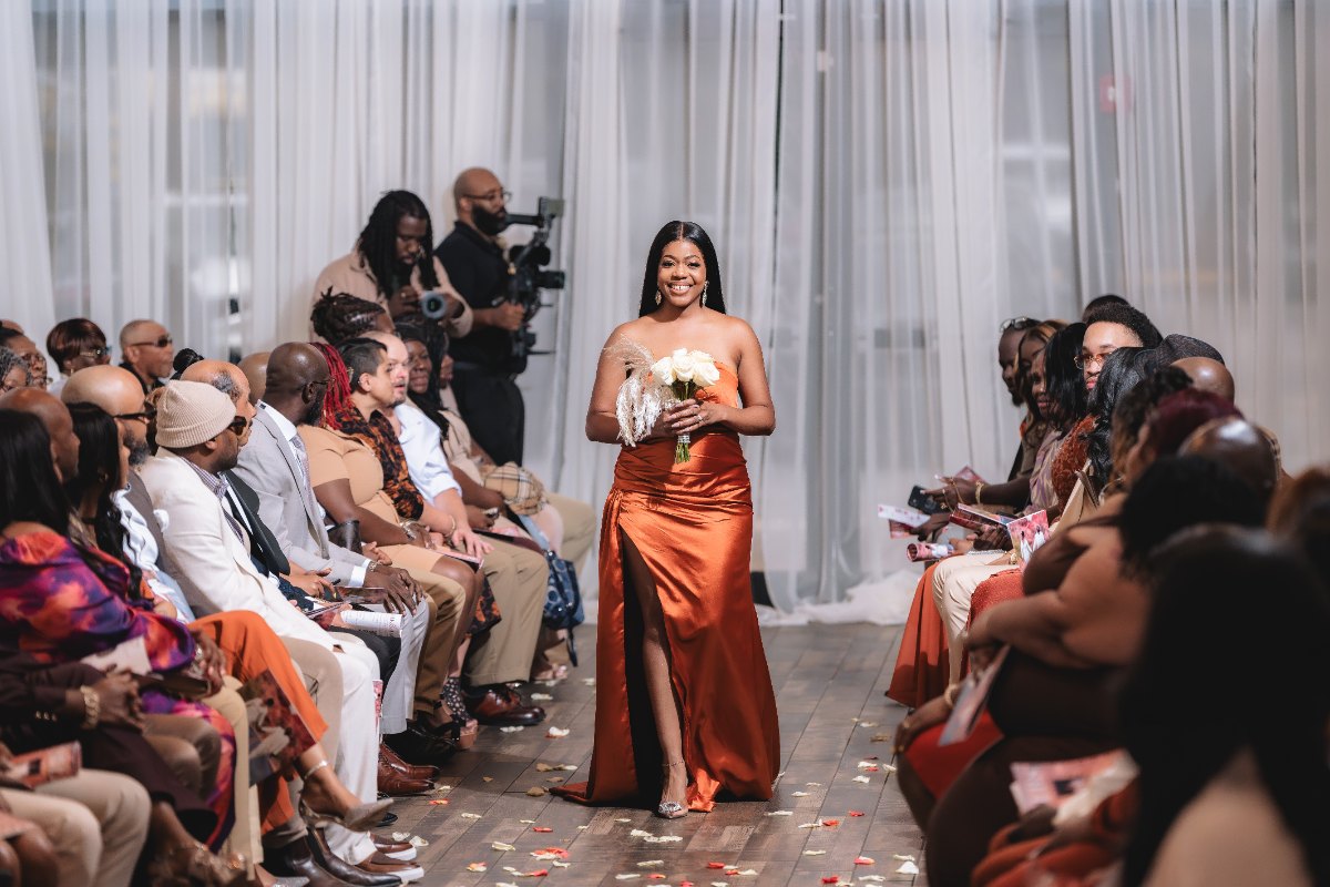 Las Vegas wedding photography — a bridesmaid walking the petal-covered aisle
