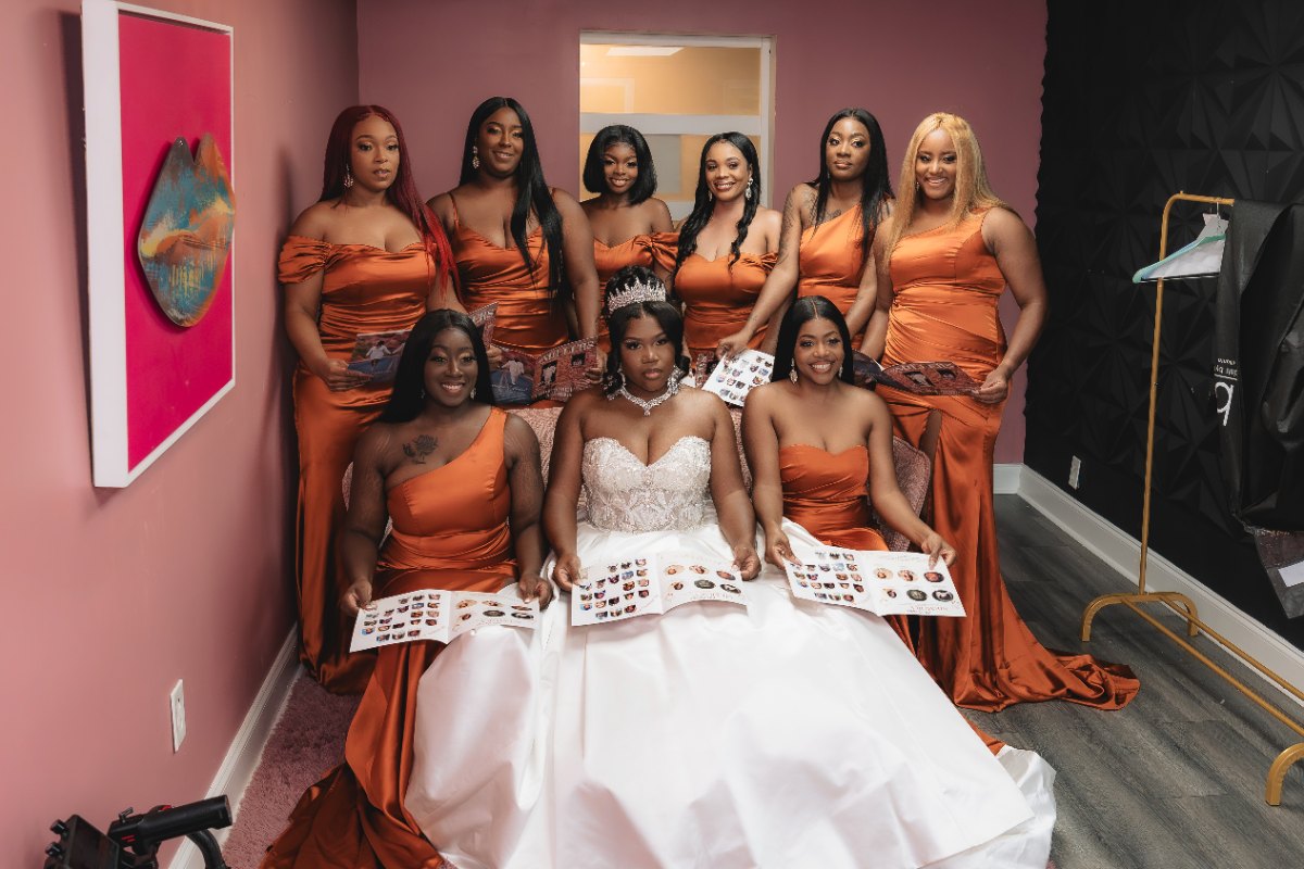 Las Vegas wedding photography — the bride seated with her bridesmaids in burnt orange