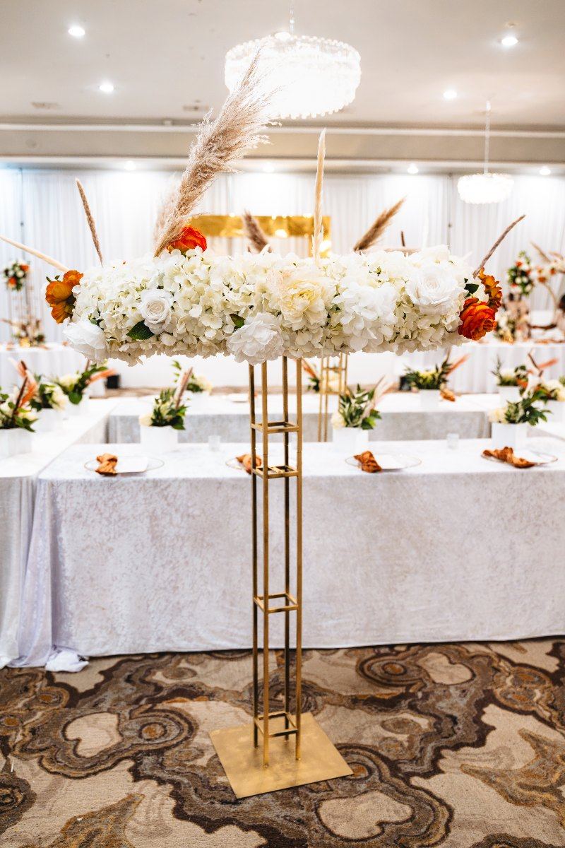 Las Vegas wedding photography — the reception room set with white and red florals