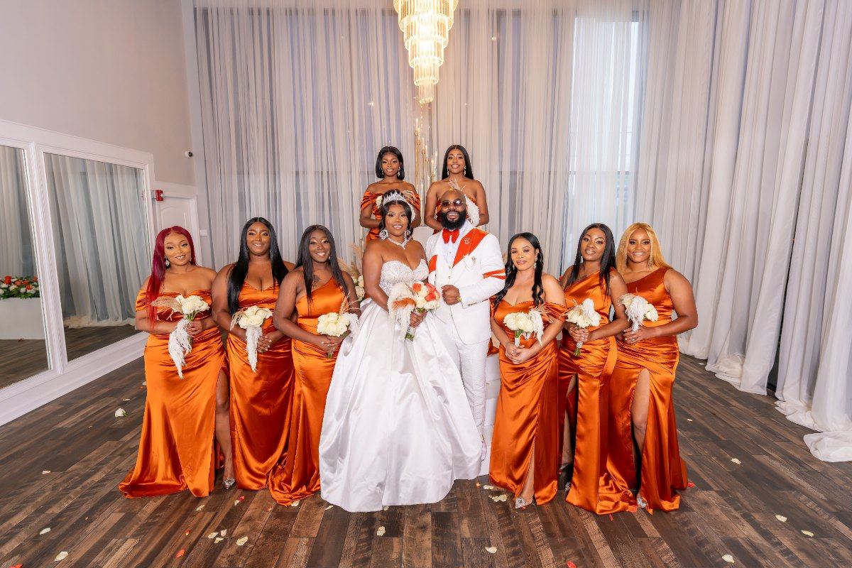 Las Vegas wedding photography — the full bridal party in burnt orange and white