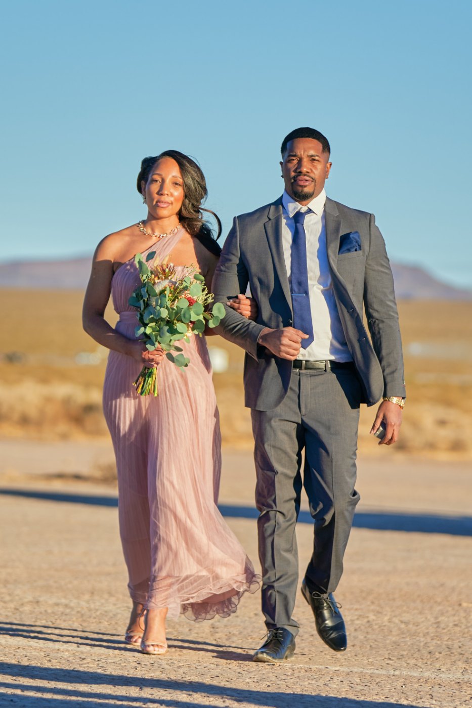 Las Vegas wedding photography — the wedding party walking in across the lake bed