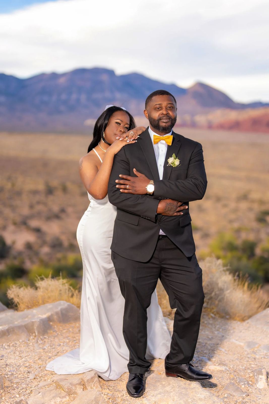 Las Vegas wedding photography — black tuxedo with a yellow bow tie in the desert