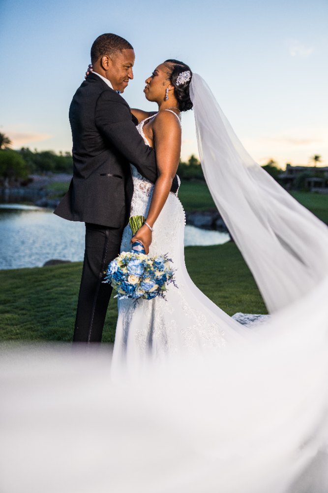 Las Vegas wedding photography — a close portrait of the couple by the water at sunset