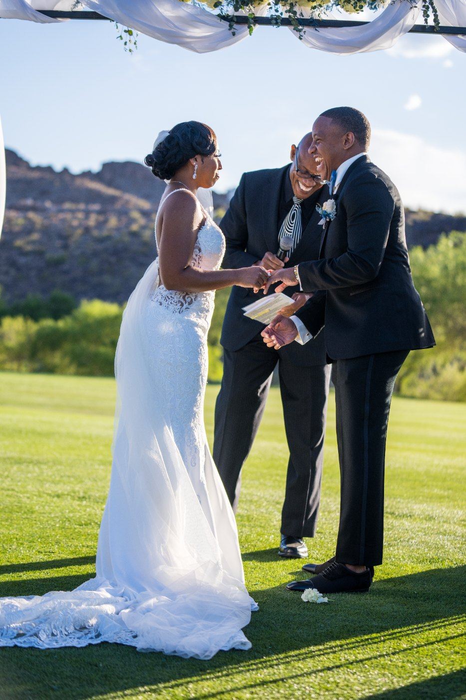Las Vegas wedding photography — the couple laughing together at the altar