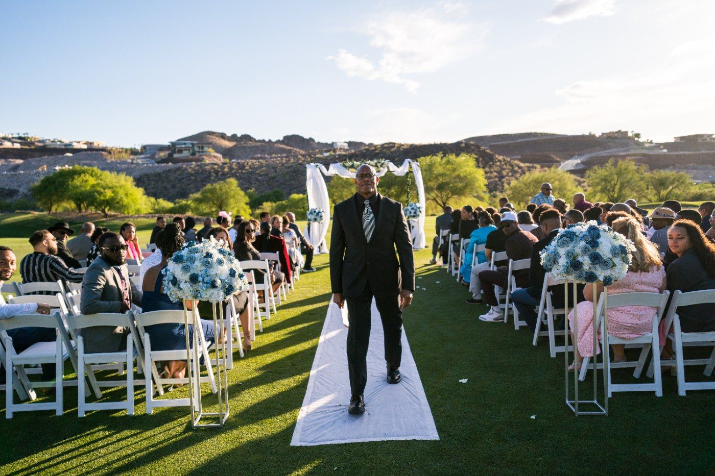 Las Vegas wedding photography — the groom walking alone down the aisle