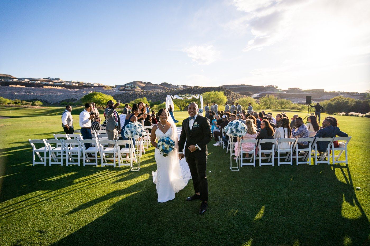 Las Vegas wedding photography — a wide view of the ceremony with the mountains behind