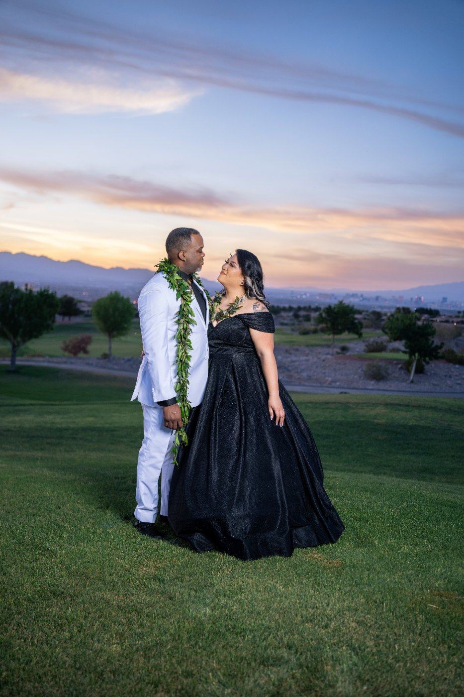 Las Vegas wedding photography — a portrait of the couple at sunset on the fairway