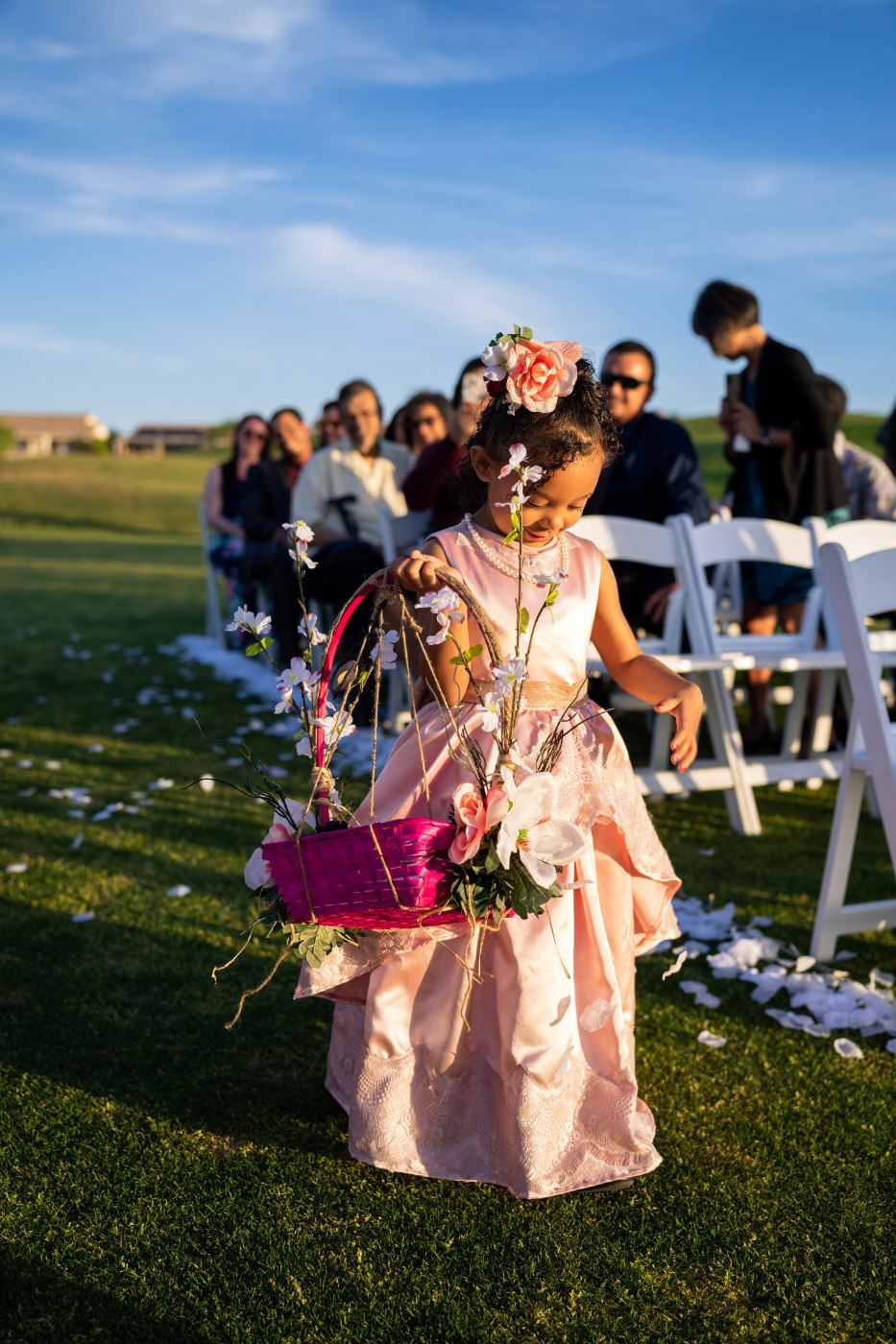 Las Vegas wedding photography — the flower girl walking the aisle in blush