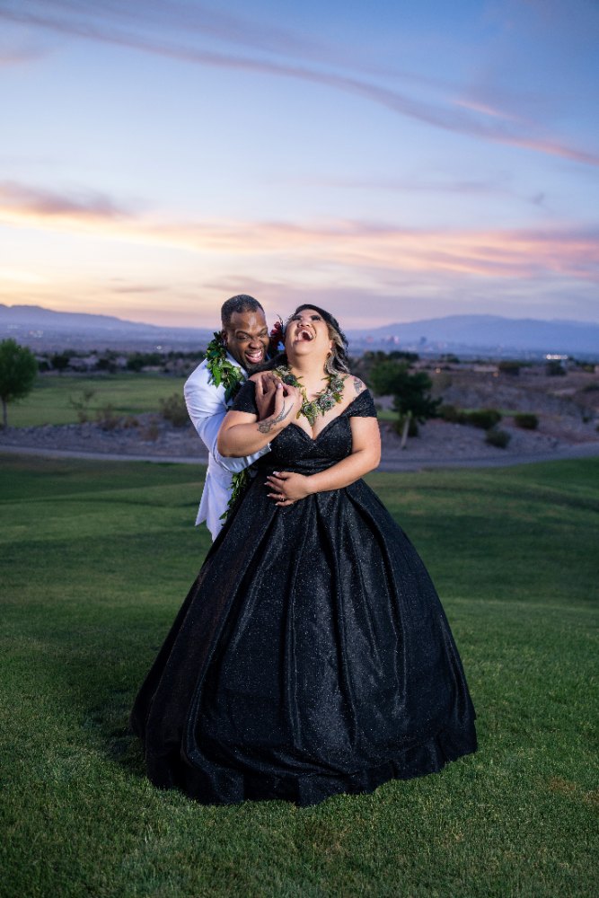 Las Vegas wedding photography — the couple laughing together in black and white formalwear