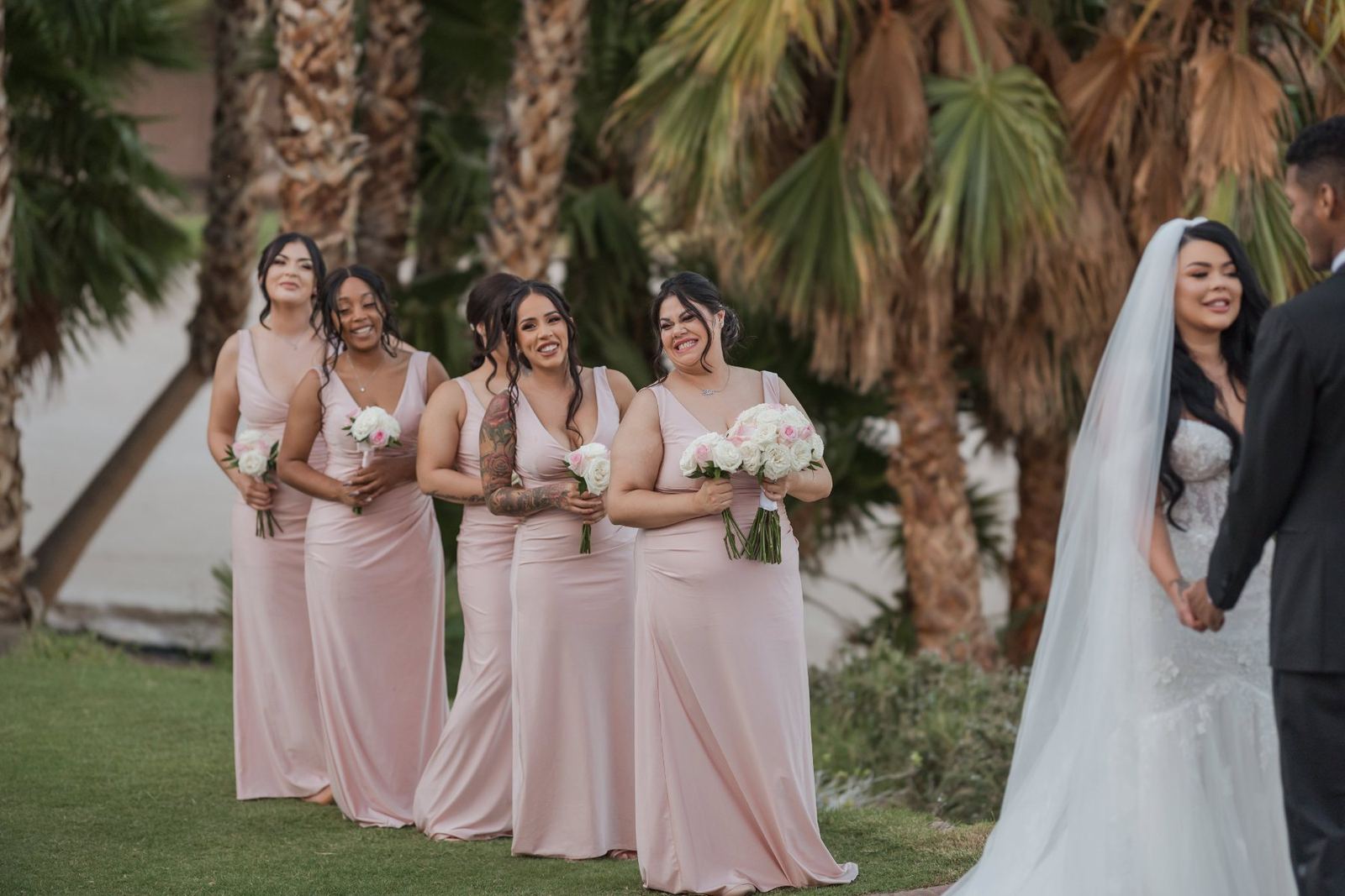 Las Vegas wedding photography — bridesmaids in blush walking with the bride