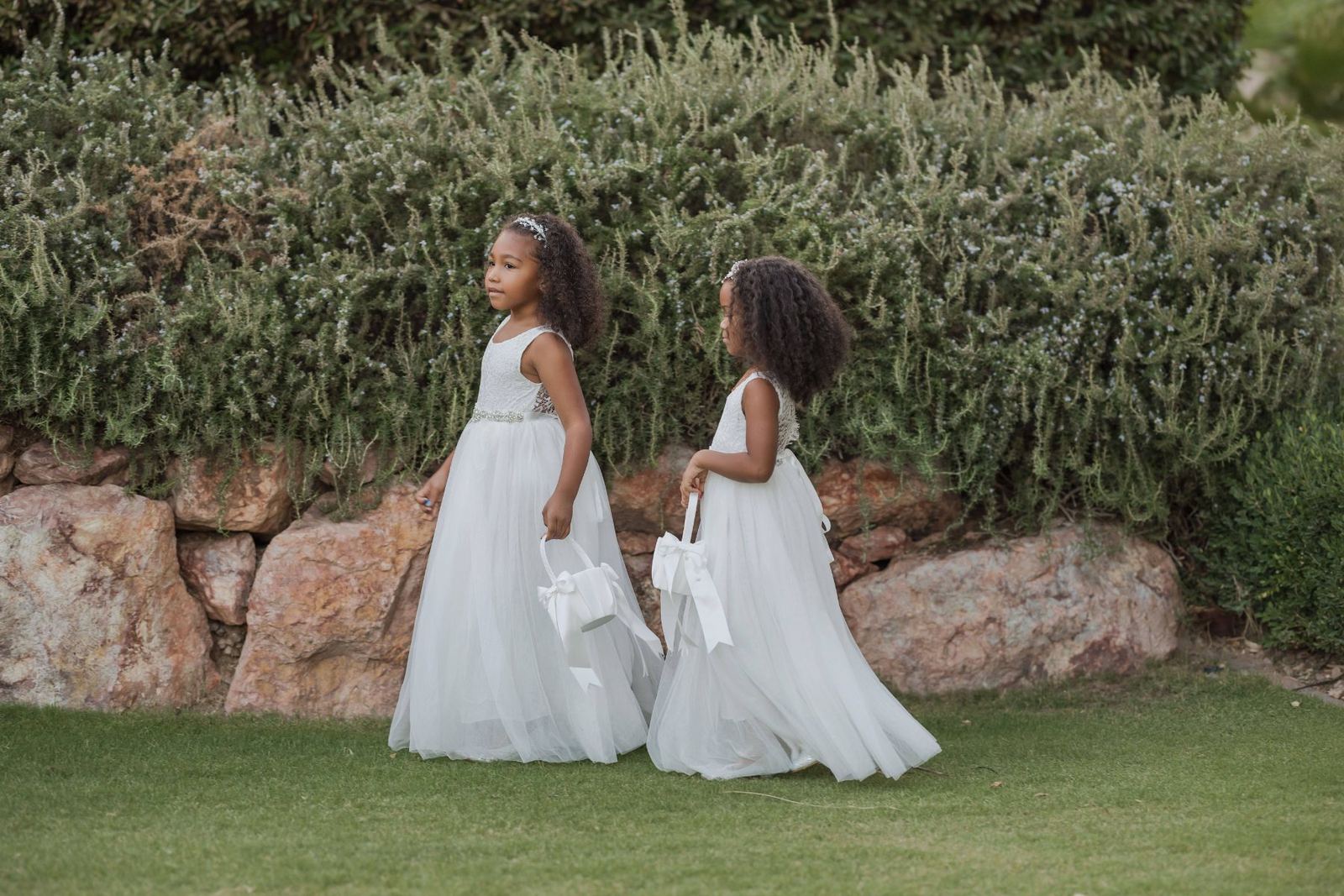 Las Vegas wedding photography — two flower girls in white in the garden