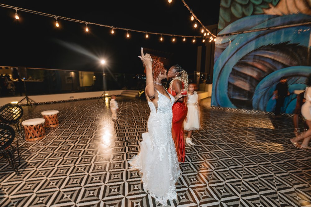 Las Vegas wedding photography — guests dancing under string lights at night