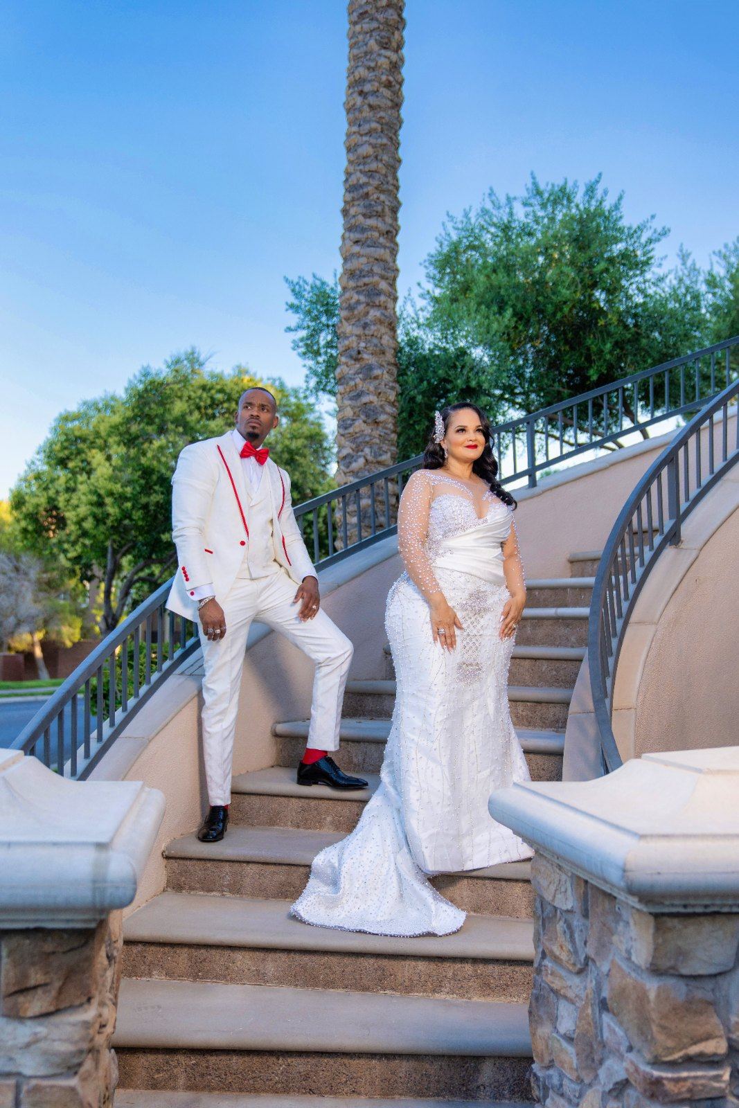 Las Vegas wedding photography — couple in white on the villa’s grand staircase