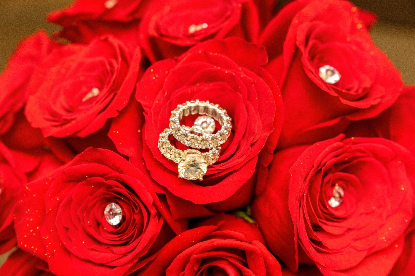 Las Vegas wedding photography — the rings nested in a bouquet of red roses