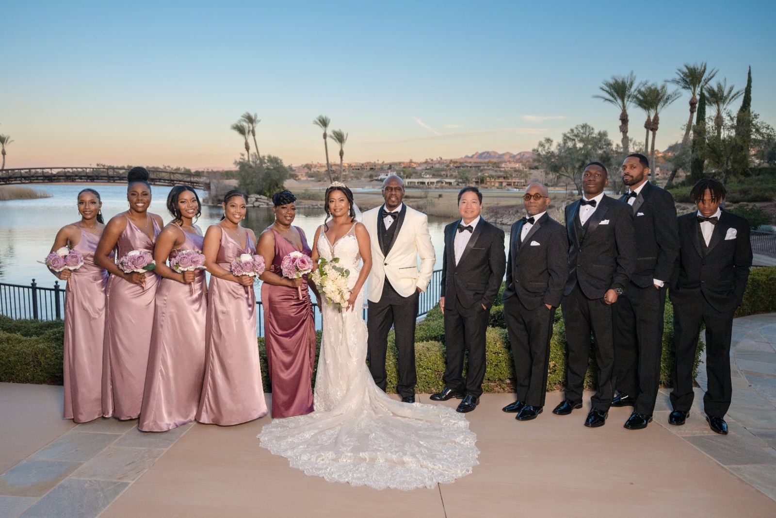 Las Vegas wedding photography — the full bridal party at sunset by the lake