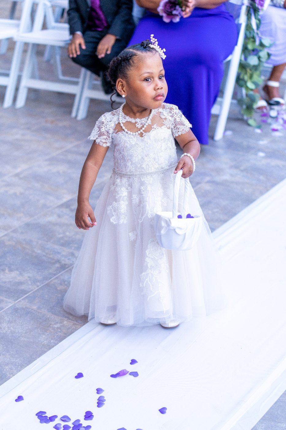 Las Vegas wedding photography — the flower girl alone on the petal-covered runner
