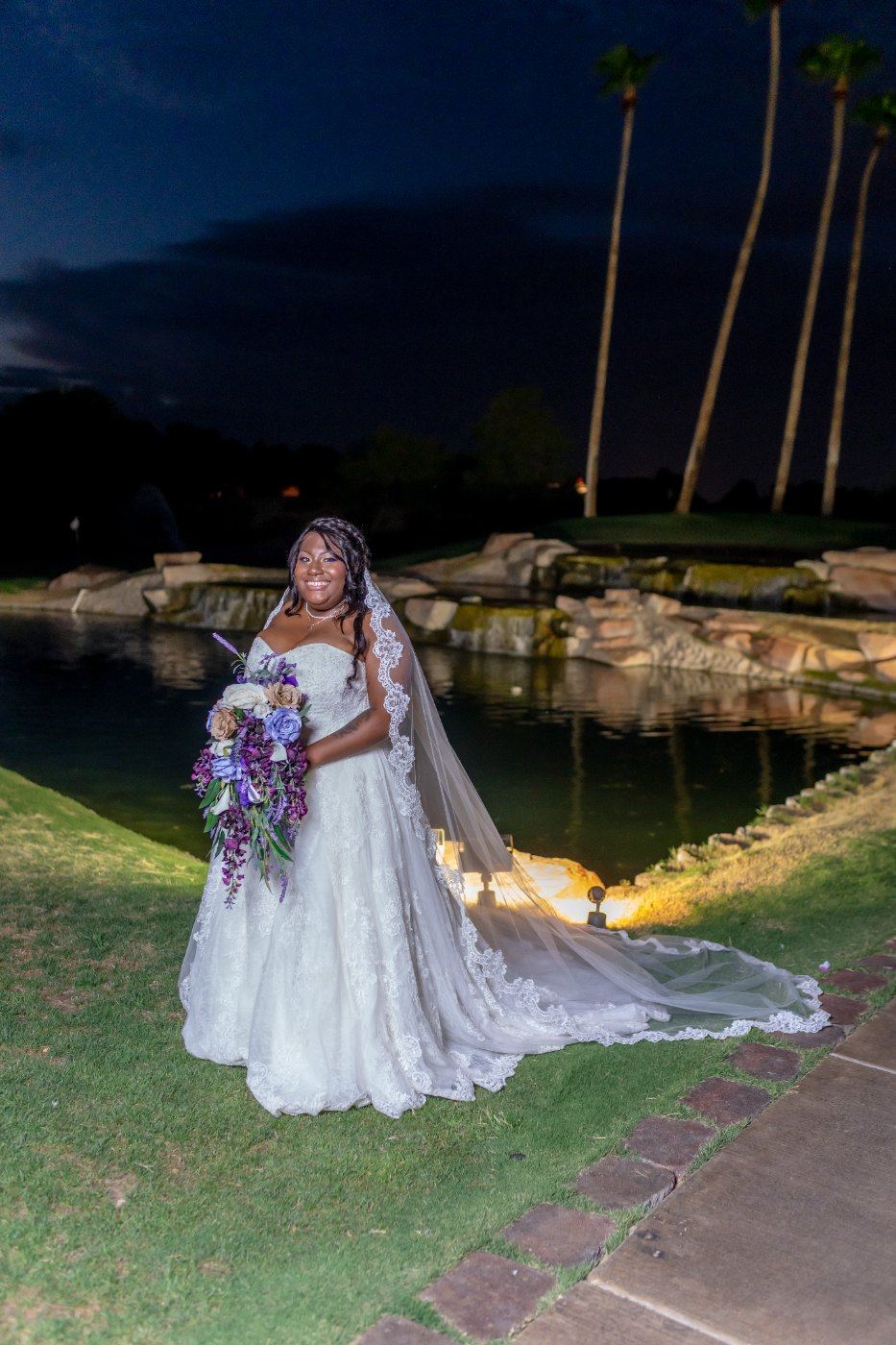 Las Vegas wedding photography — the bride alone by the water after dark