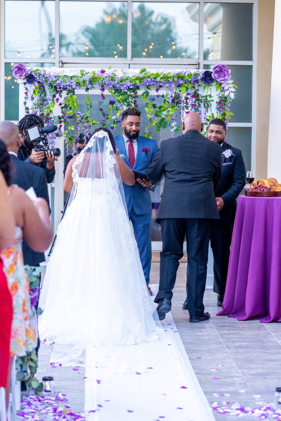 Las Vegas wedding photography — the bride walking down the aisle, veil trailing