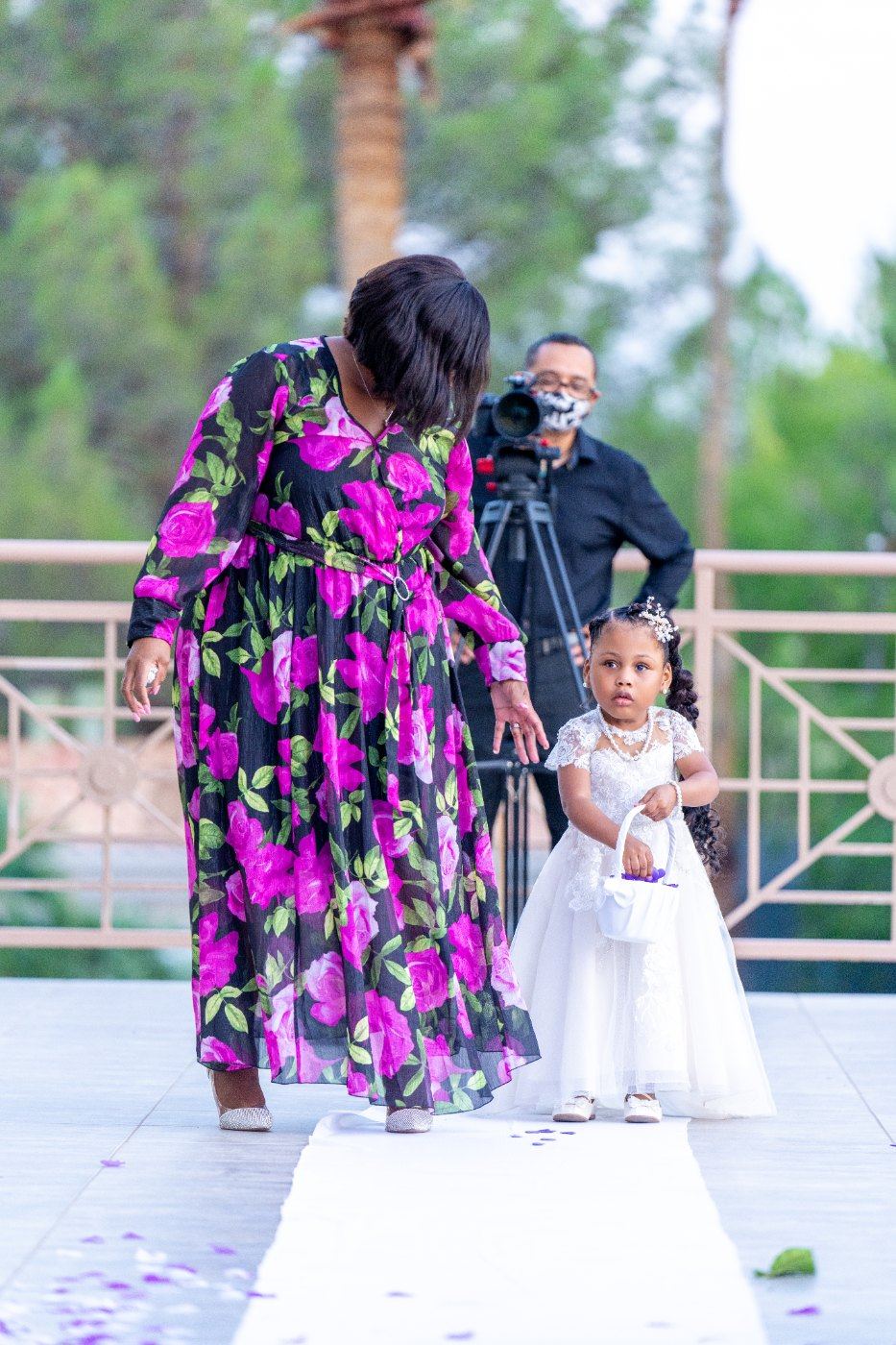 Las Vegas wedding photography — the flower girl being walked down the aisle