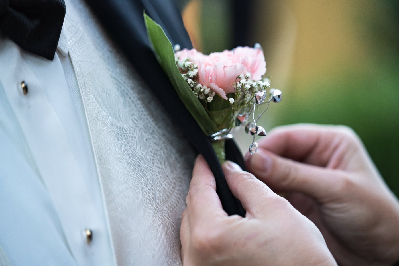 Las Vegas wedding photography — the boutonniere being pinned before the ceremony