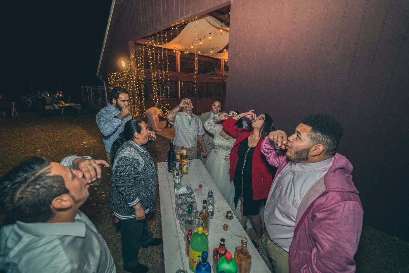 Las Vegas wedding photography — a toast around the table after dark