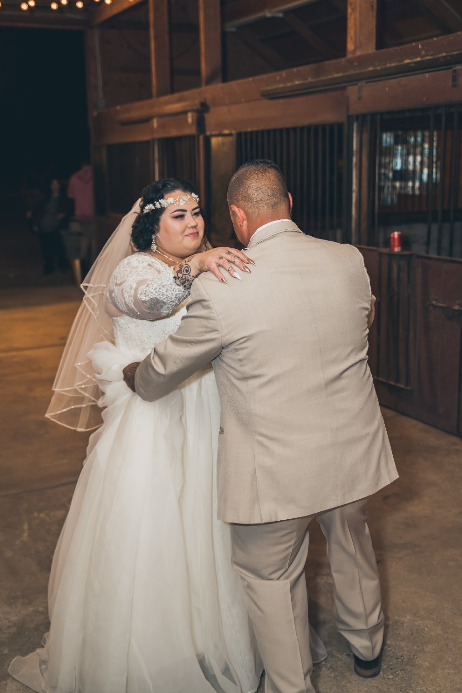 Las Vegas wedding photography — the couple slow dancing inside the barn