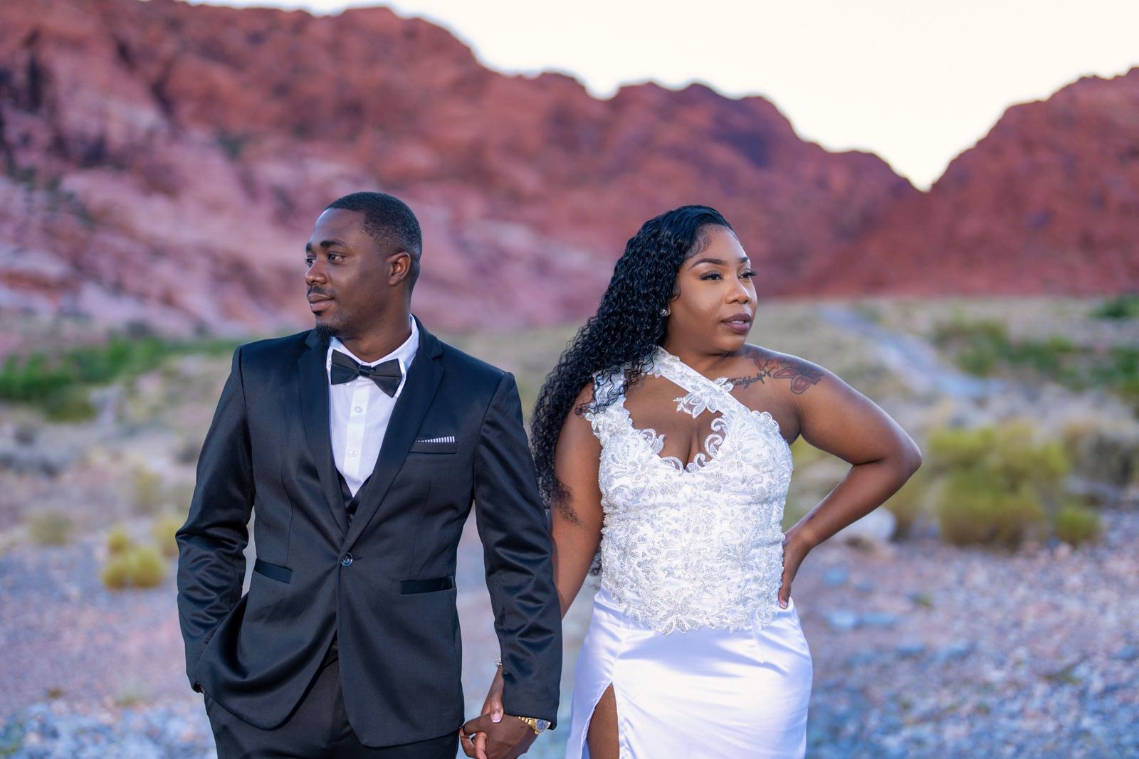 Las Vegas wedding photography — bride and groom against the red canyon wall