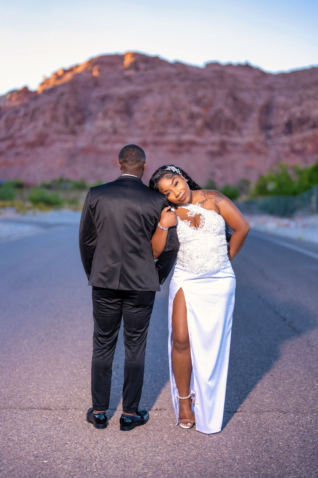 Las Vegas wedding photography — the bride leaning on his shoulder at Red Rock