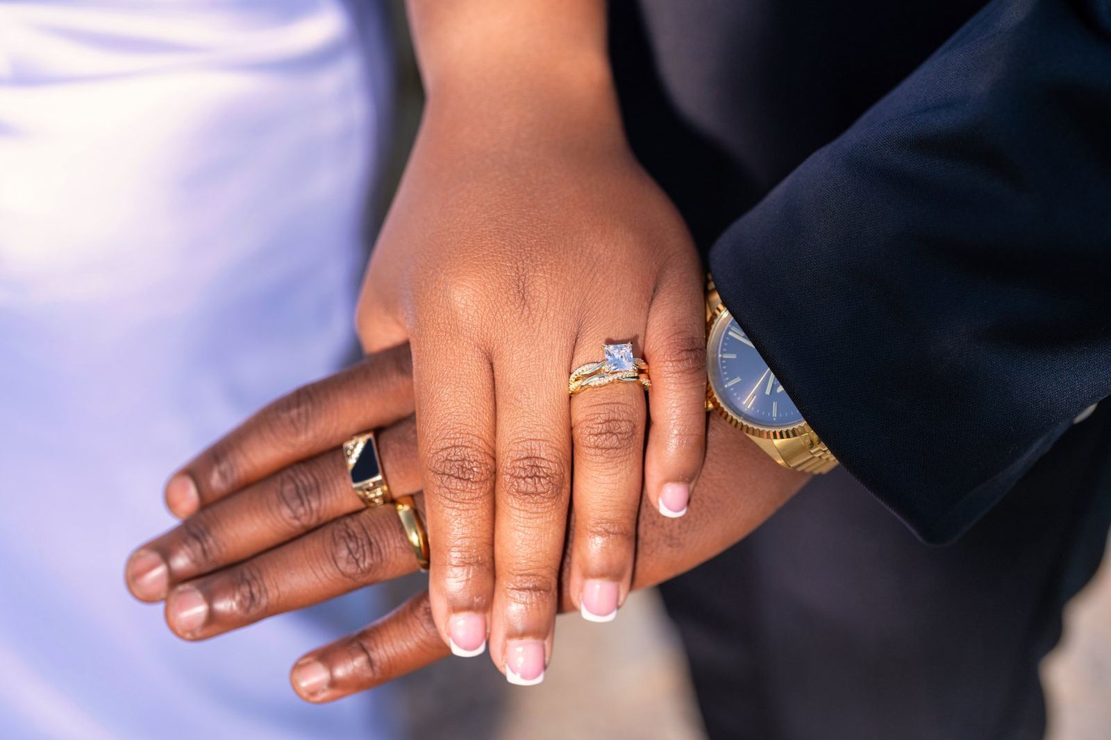 Las Vegas wedding photography — their rings and his watch, hands together