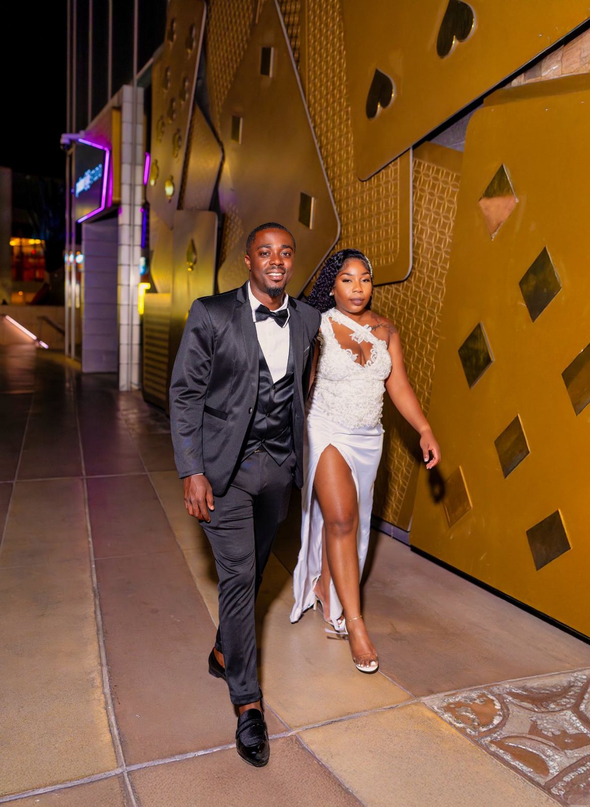Las Vegas wedding photography — walking the Strip at night in gown and tuxedo